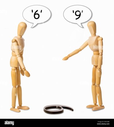 two-mannikins-arguing-whether-a-number-on-the-floor-is-a-6-or-a-9-E5N1BM.jpg